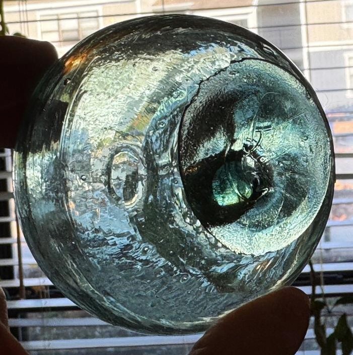 Crude aqua-green glass float, 3 1/4 inches diameter
