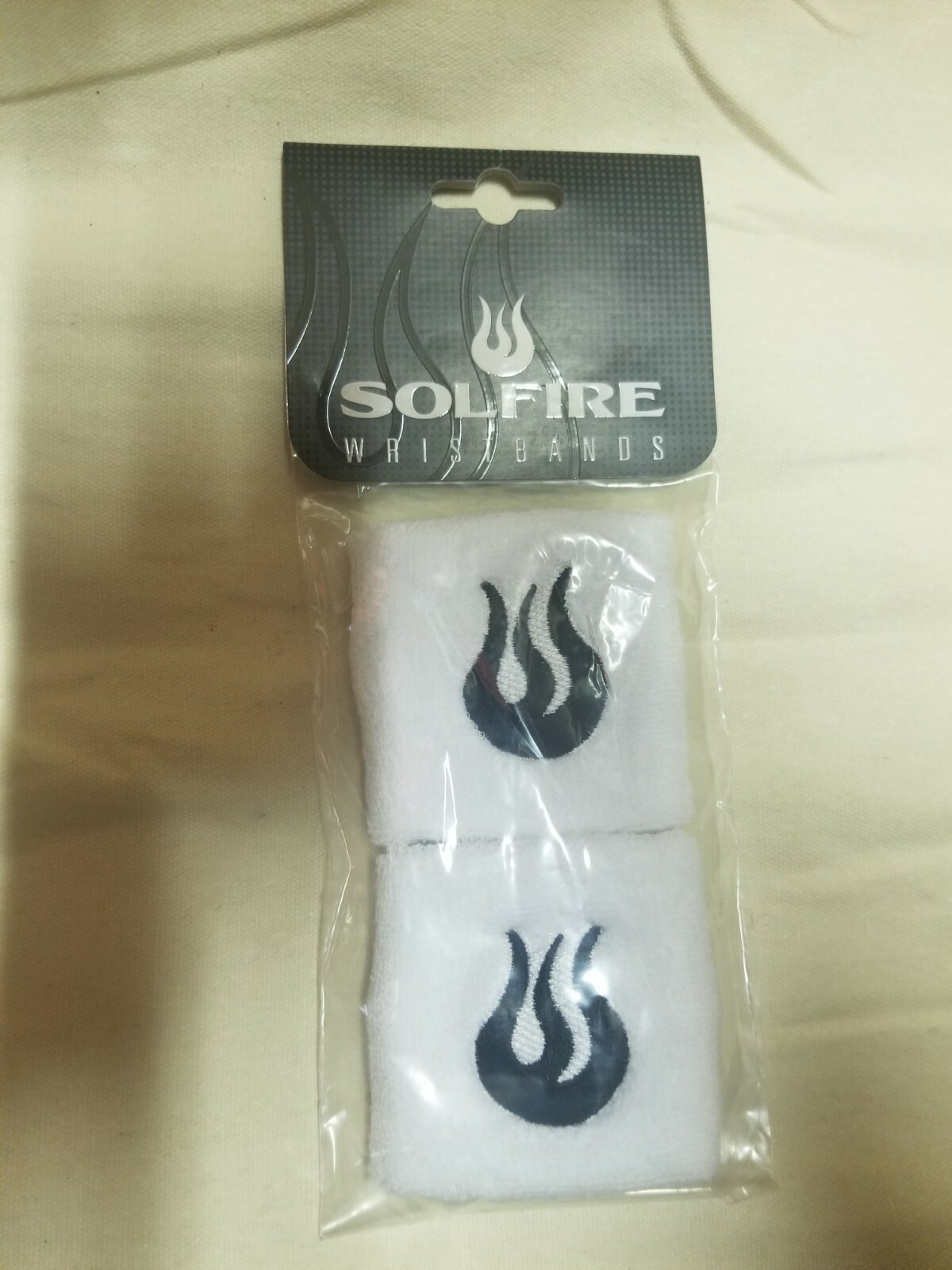 New Solfire Athletic Sweat Wristbands. White With Black Flame.