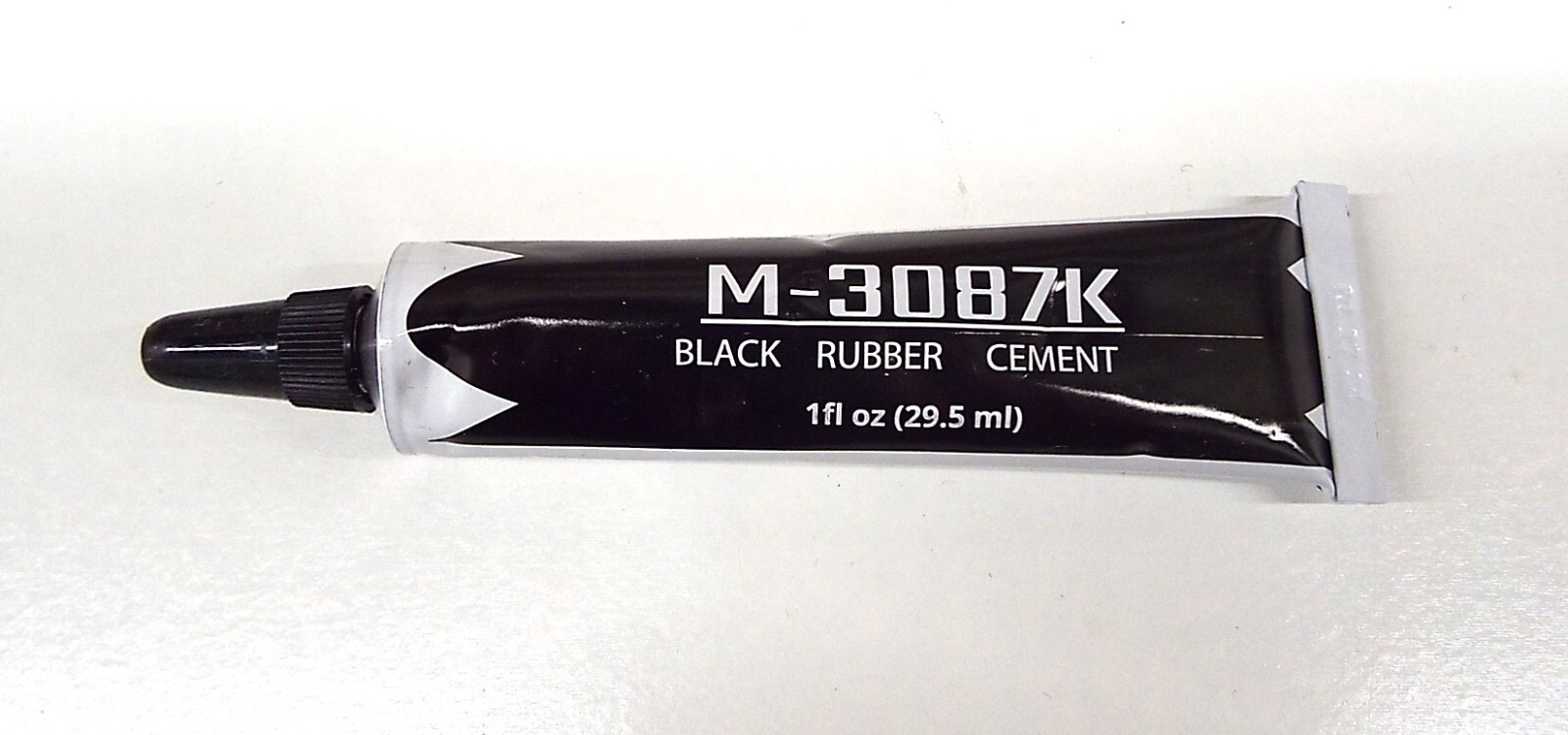 Tube of Black Speaker Repair Glue for all woofer cones, foam & rubber surrounds