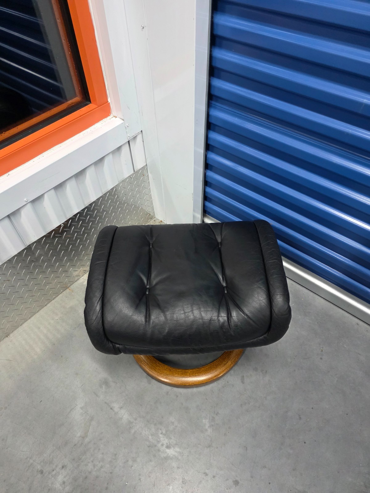 Ekornes Stressless Black Colored Leather Ottoman | Teak Stained Wood Base