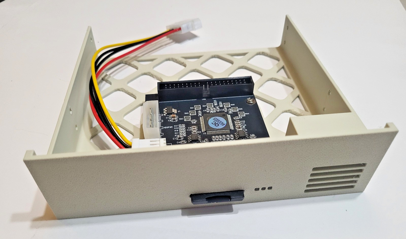 Beige 5.25" SD to IDE adapter with storage and indicator lights