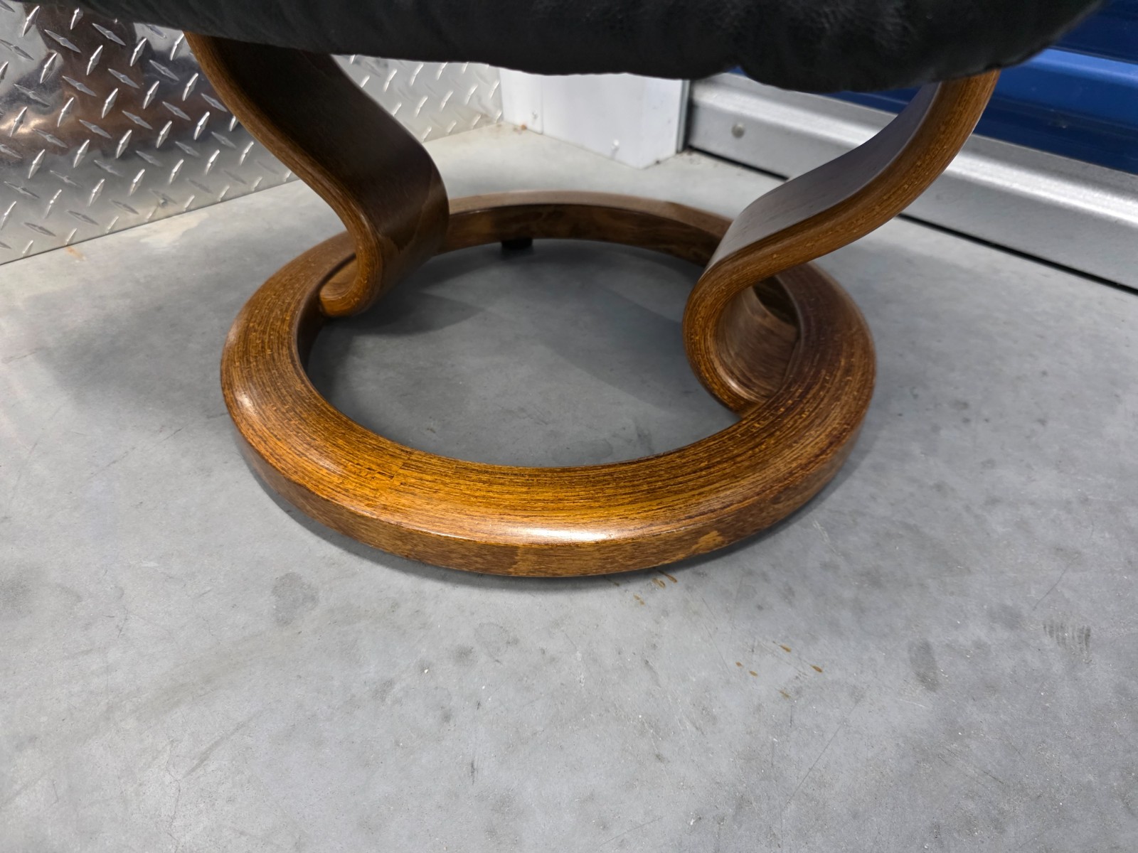 Ekornes Stressless Black Colored Leather Ottoman | Teak Stained Wood Base