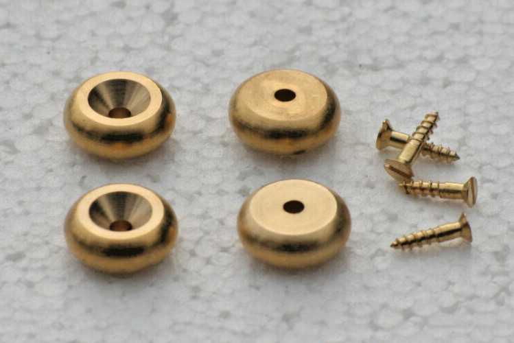 A SET OF 4 STYLISH CAST BRASS BUN STYLE CLOCK FEET.