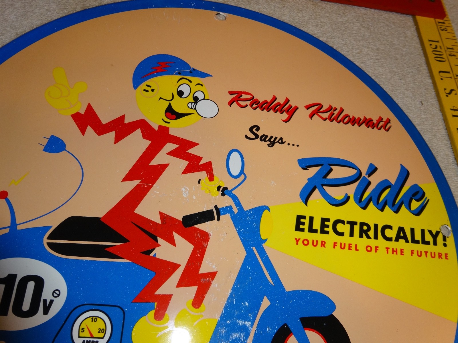 VINTAGE 56 REDDY KILOWATT ELECTRIC SCOOTER 11 3/4" PORCELAIN METAL GASOLINE SIGN