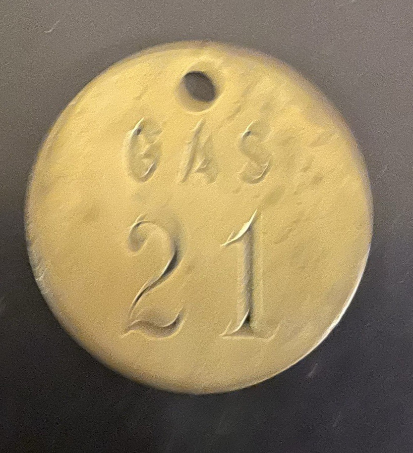 Lot of 9 vintage brass gasoline tags