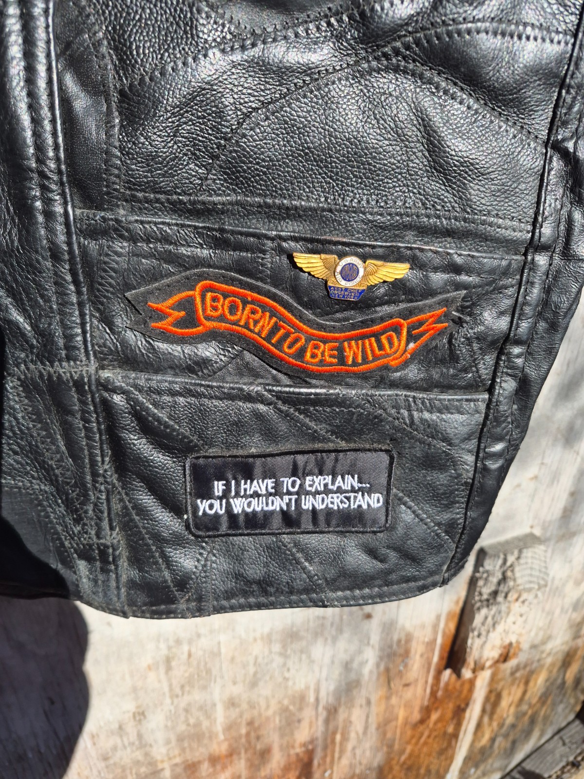 Vintage harley hog leather vest filled with pins and has patches 2xl