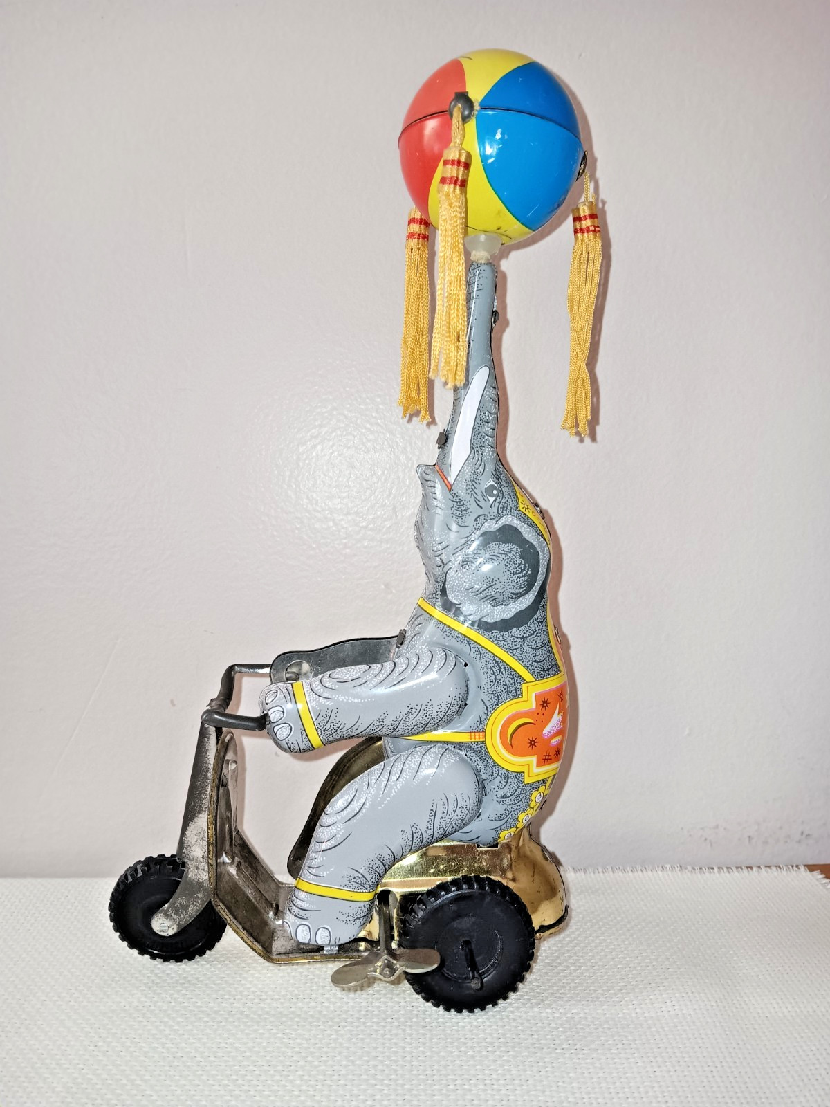 Tin Toy Elephant on Trike With Ball on Nose, 9 Inches Tall