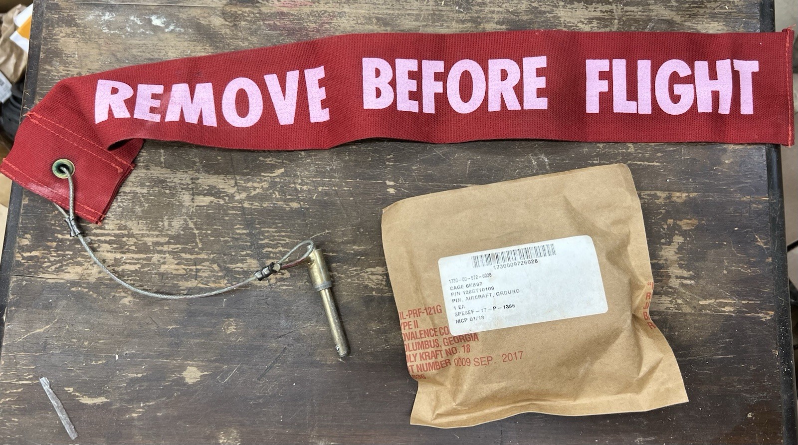 REMOVE BEFORE FLIGHT ground safety lock pin & flag.  AIRCRAFT
