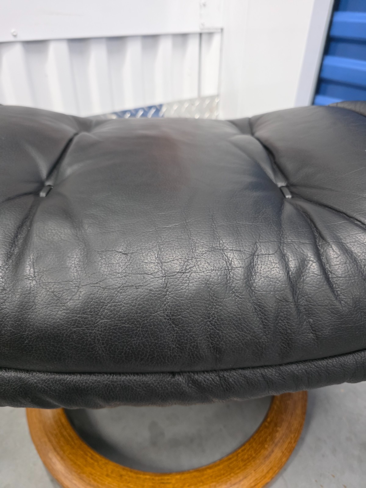 Ekornes Stressless Black Colored Leather Ottoman | Teak Stained Wood Base