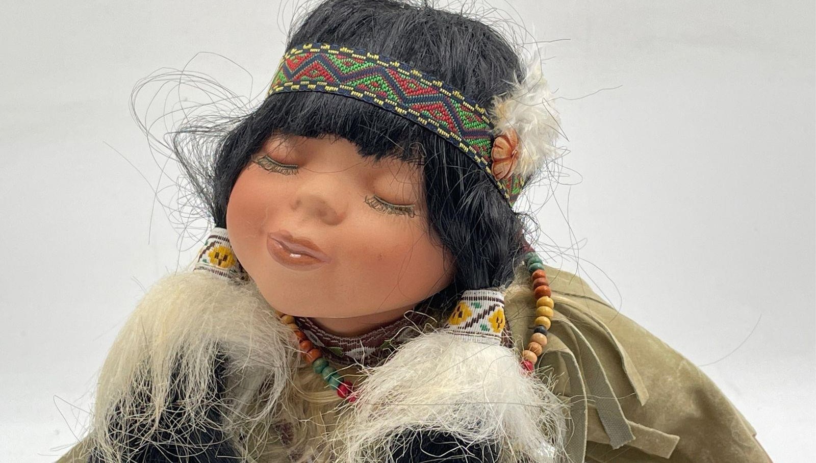 Vintage Native American Girl Doll in Kissing Expression Closed Eyes Sitting Pose