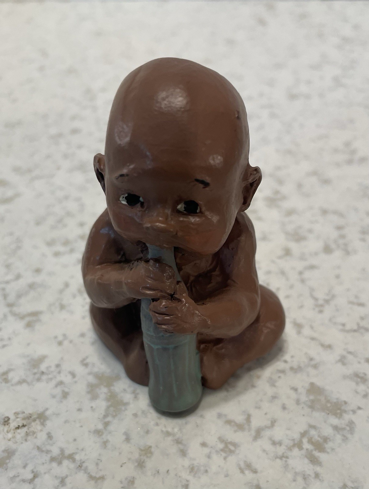 Baby With Coke Bottle 2 1/2” Tall Handcrafted, Signed Figurine