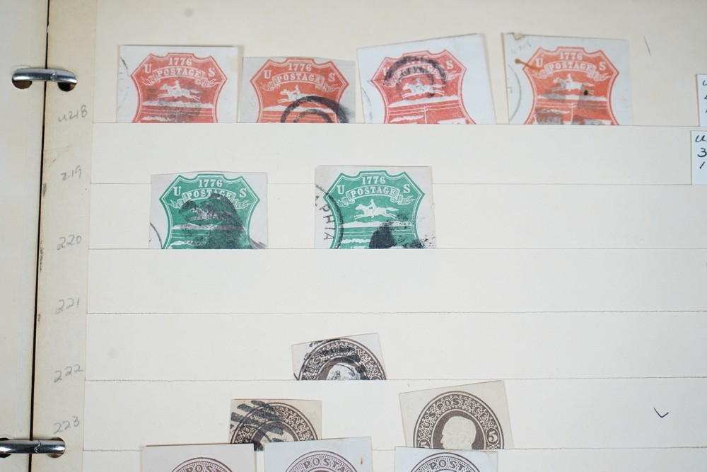 US COLLECTION OF 1,200+ STATIONERY CUT SQUARE STAMPS STORED IN STOCKBOOK