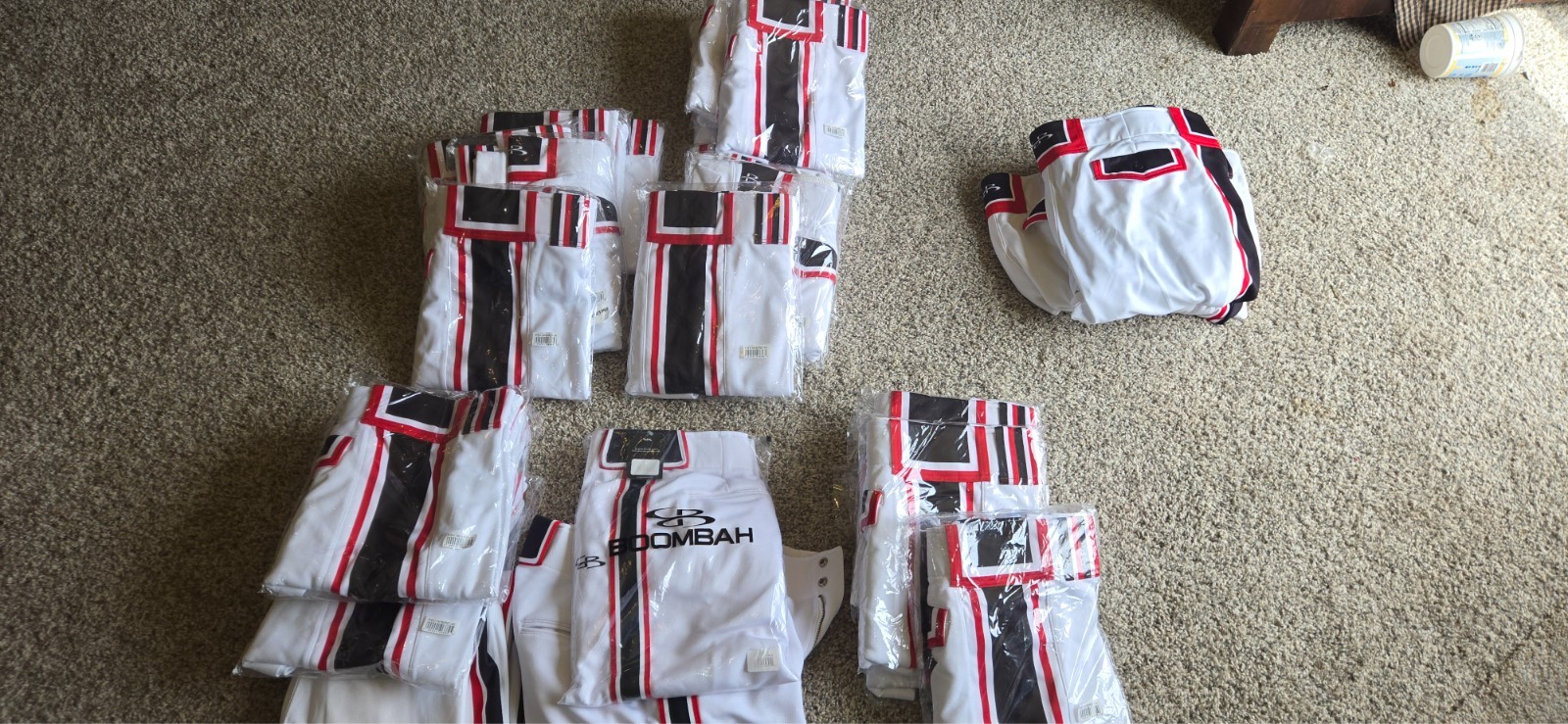 70 pairs Men's softball pants, White, Red, Black. Most new.