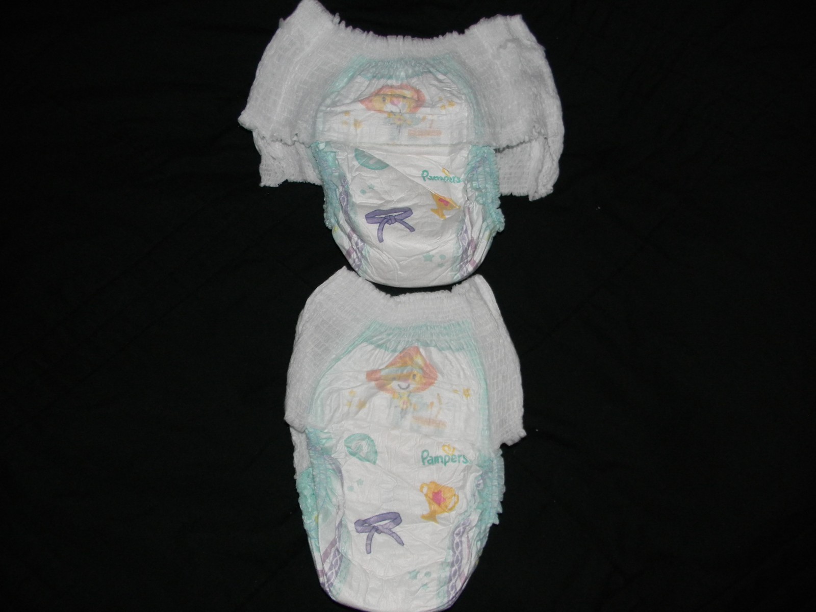 4 Pampers size 9 pants 41+Lbs. made to fit 32 in waist easy.