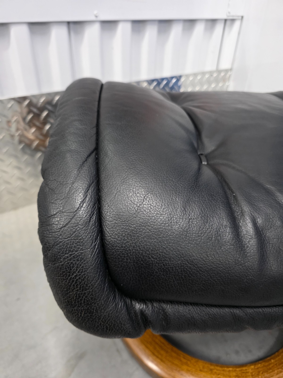 Ekornes Stressless Black Colored Leather Ottoman | Teak Stained Wood Base