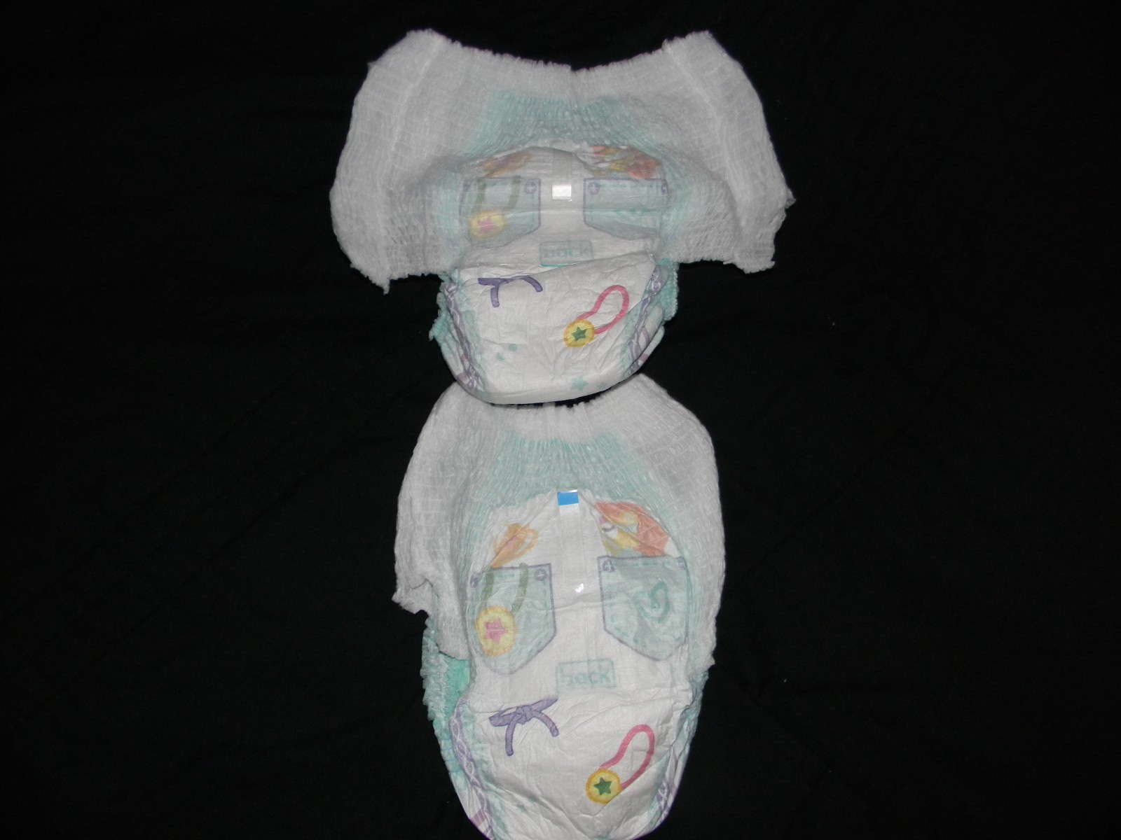 4 Pampers size 9 pants 41+Lbs. made to fit 32 in waist easy.