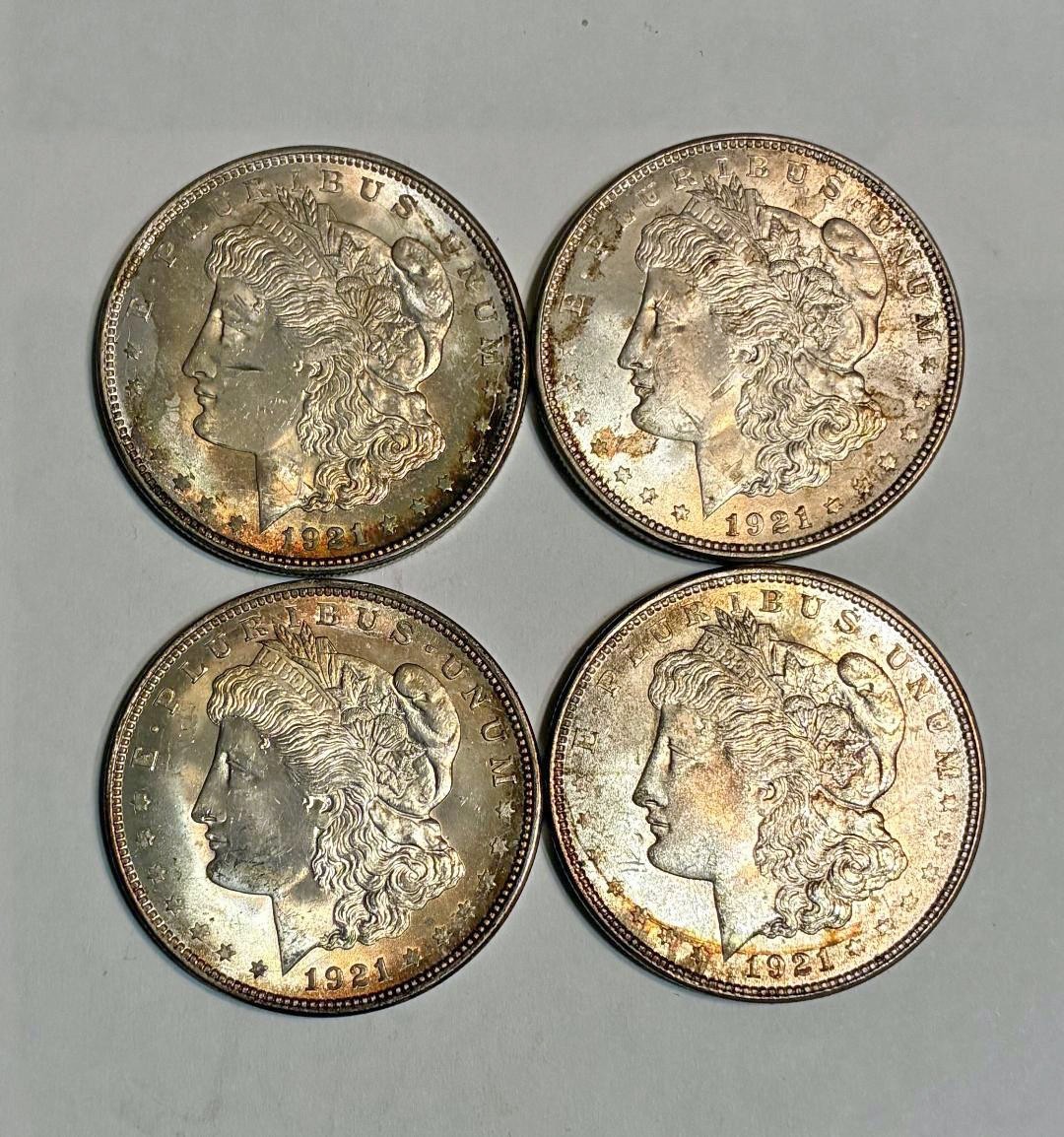 Lot of four 1921 Morgan silver dollars