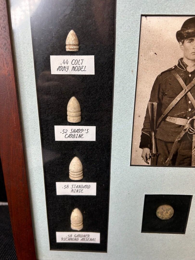 Original framed Civil War bullets and button
