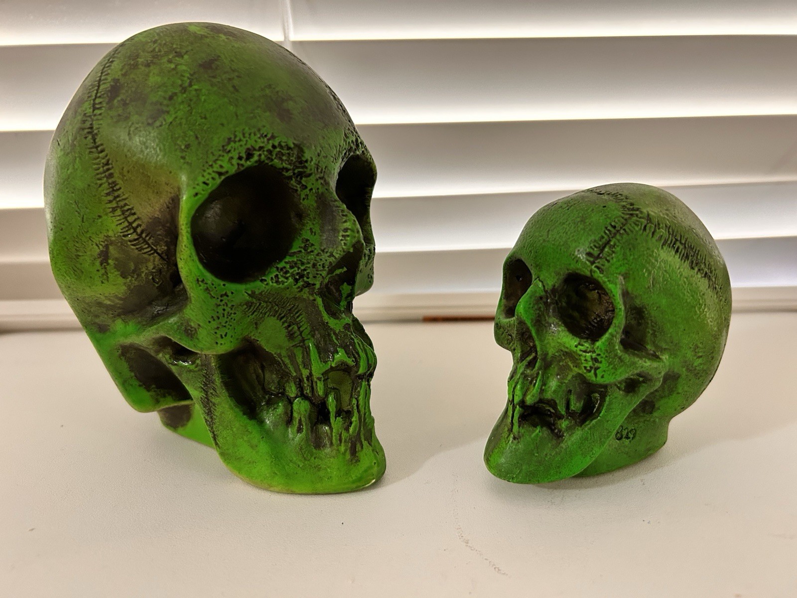 2 EA. RANDOTTI ORIGINAL FLUORESCENT GREEN LARGE & MEDIUM SKULLS STILL GLOW