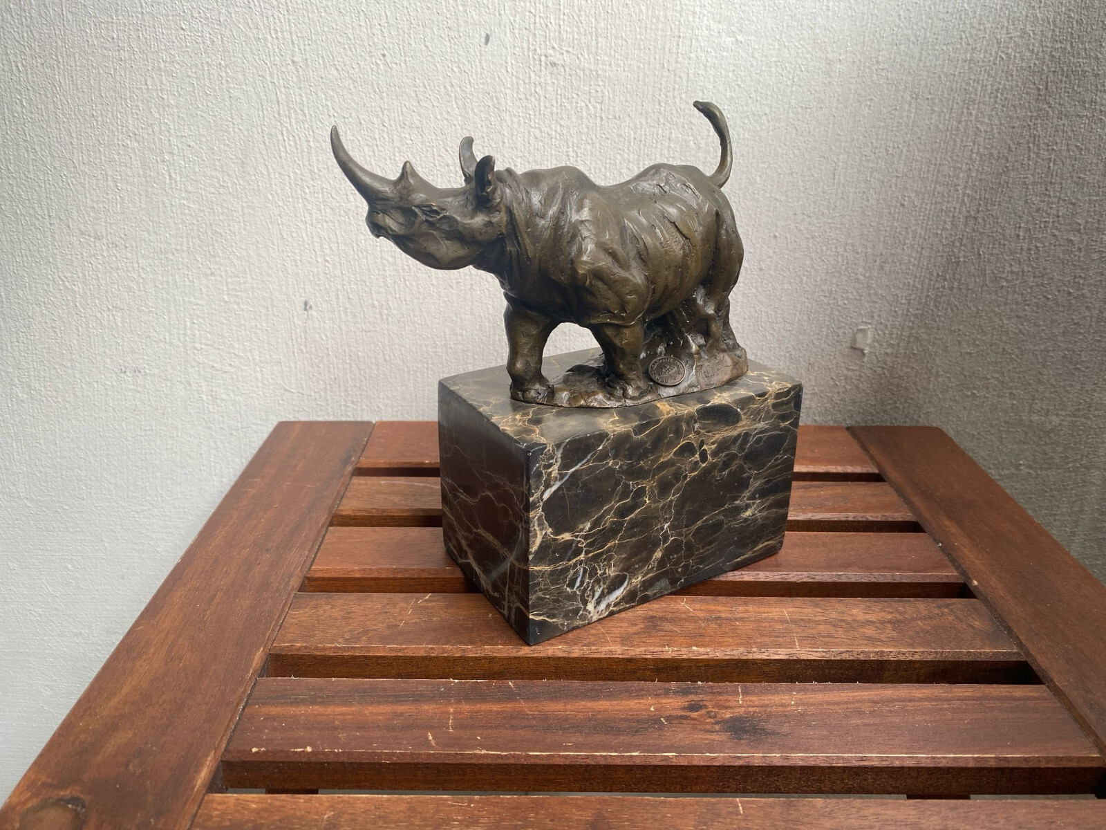 Bronze sculpture Walking Rhinoceros on a black marble base after Milo