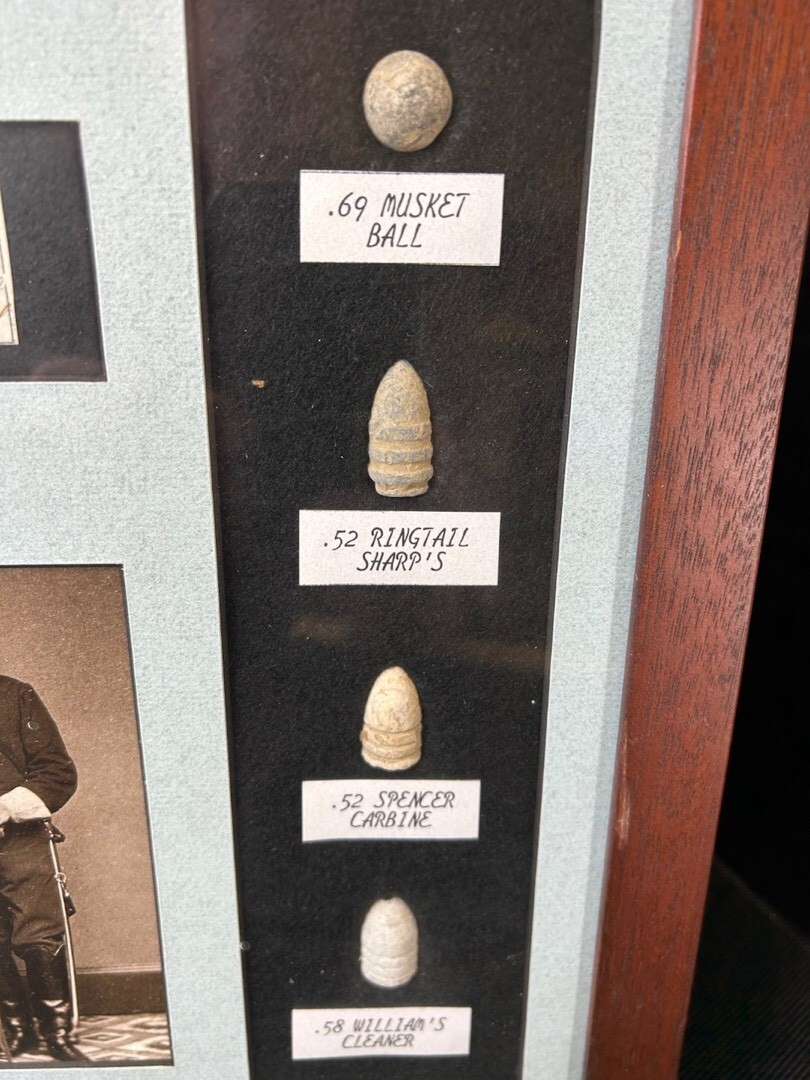 Original framed Civil War bullets and button