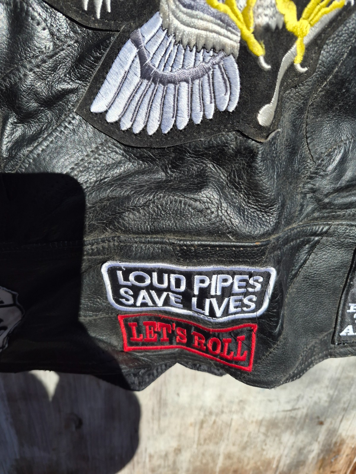 Vintage harley hog leather vest filled with pins and has patches 2xl