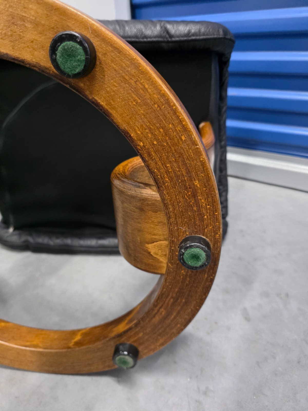 Ekornes Stressless Black Colored Leather Ottoman | Teak Stained Wood Base