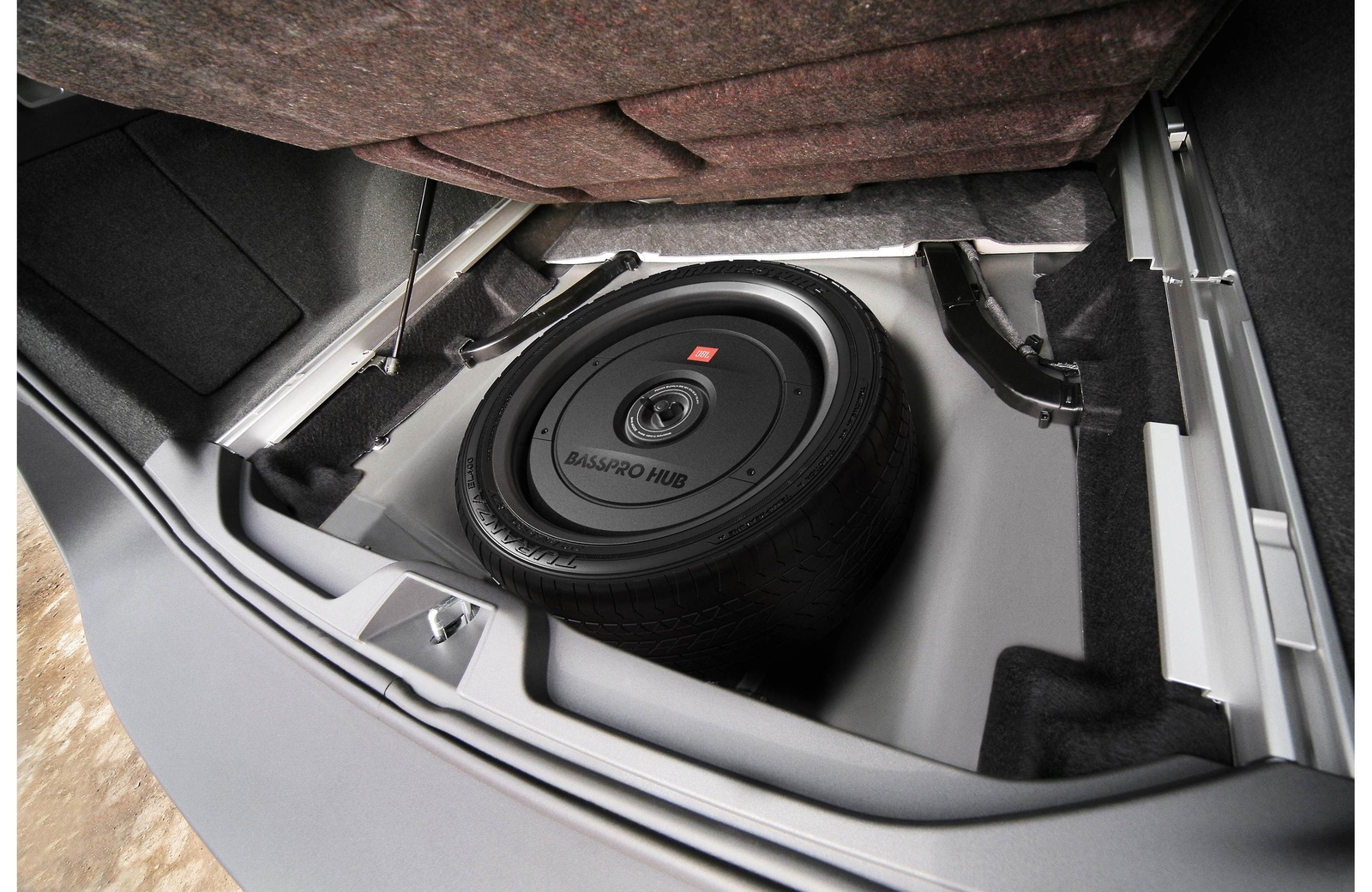 JBL BassPro Hub 11" subwoofer enclosure w. 200 W amp mounts to hub of spare tire