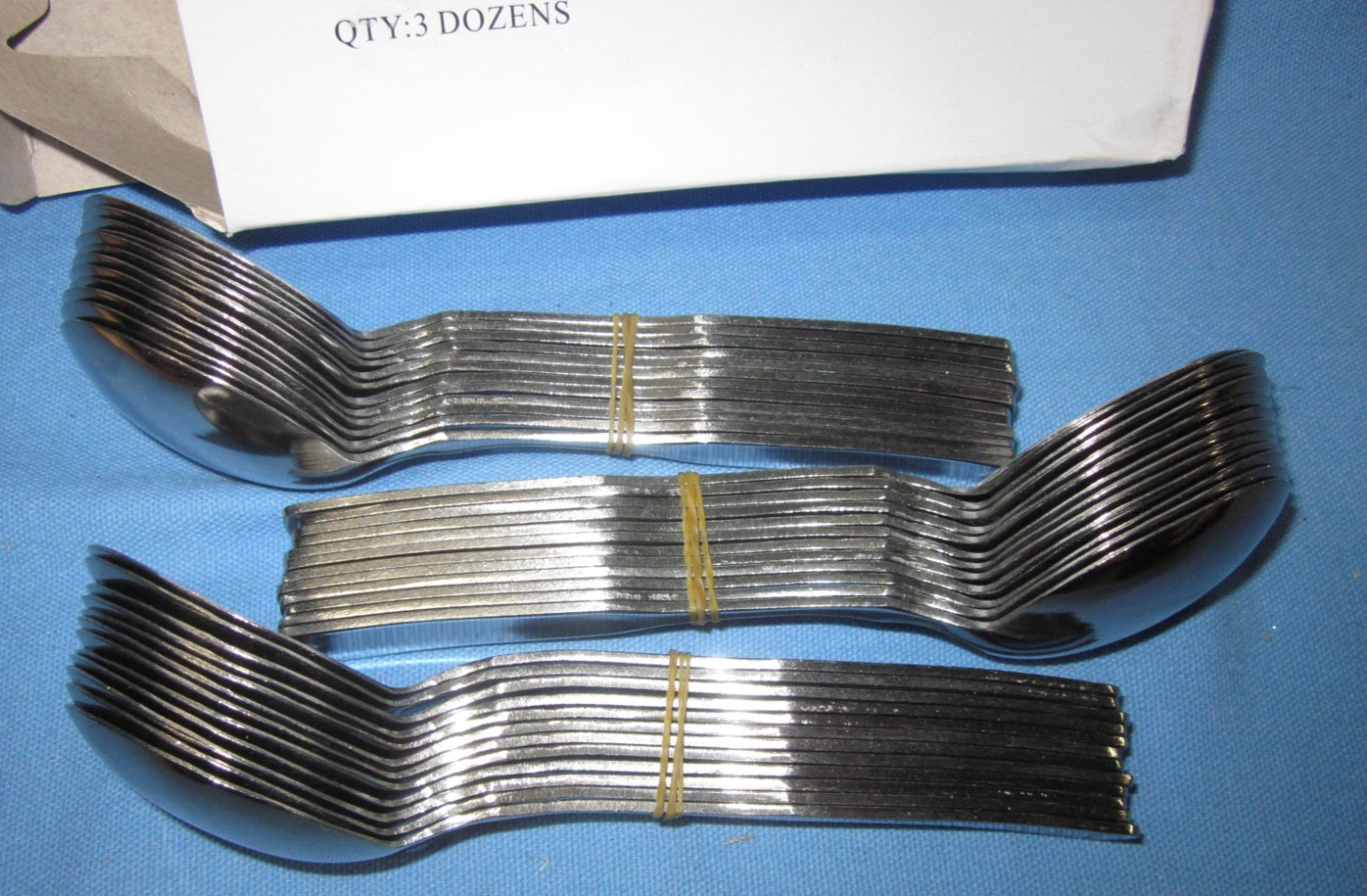 a Box of 36 Global LLC Olive Garden Bouillon Spoons