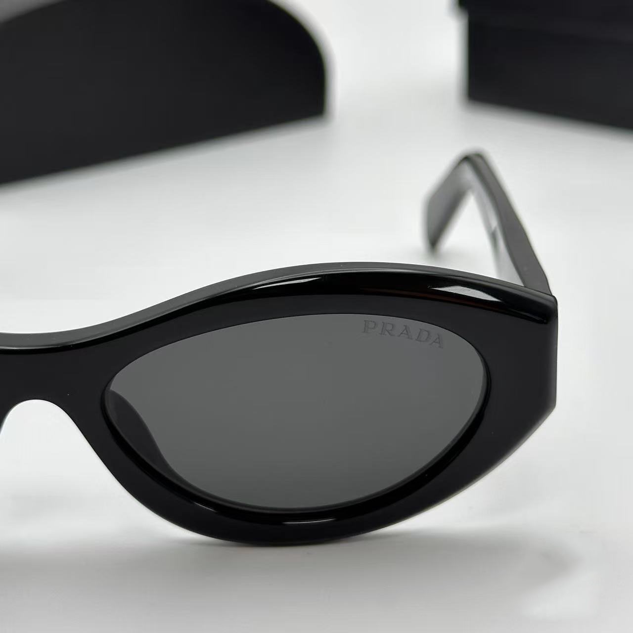 PRADA SPR26Z Black Sunglasses Polished Black Gray Tint Silver Logo