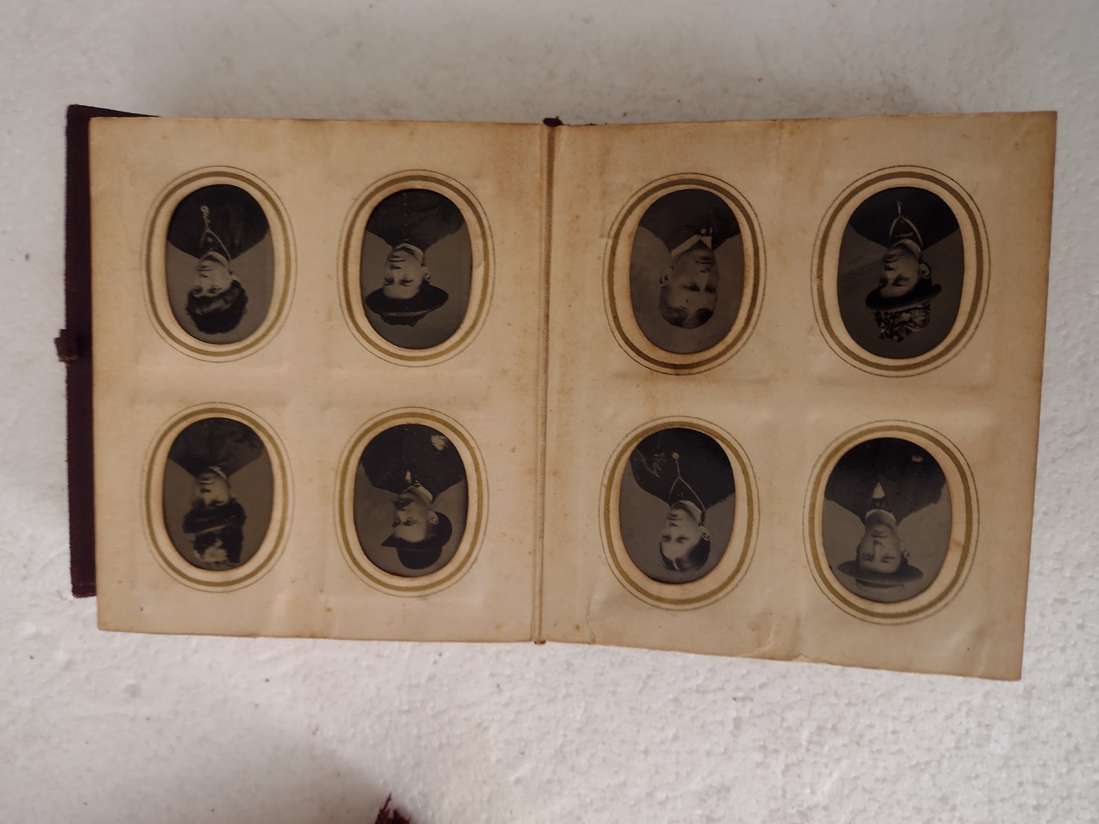 Tintype portraits in two old L;eather Albums 4x4x1
