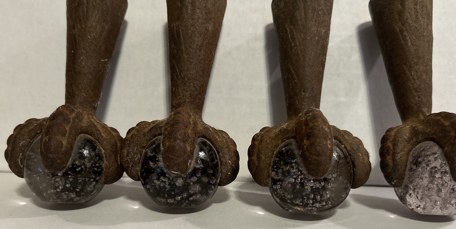 Set of 4 Vintage Art Deco Cast Iron Glass Claws and Ball Furniture Feet Casters