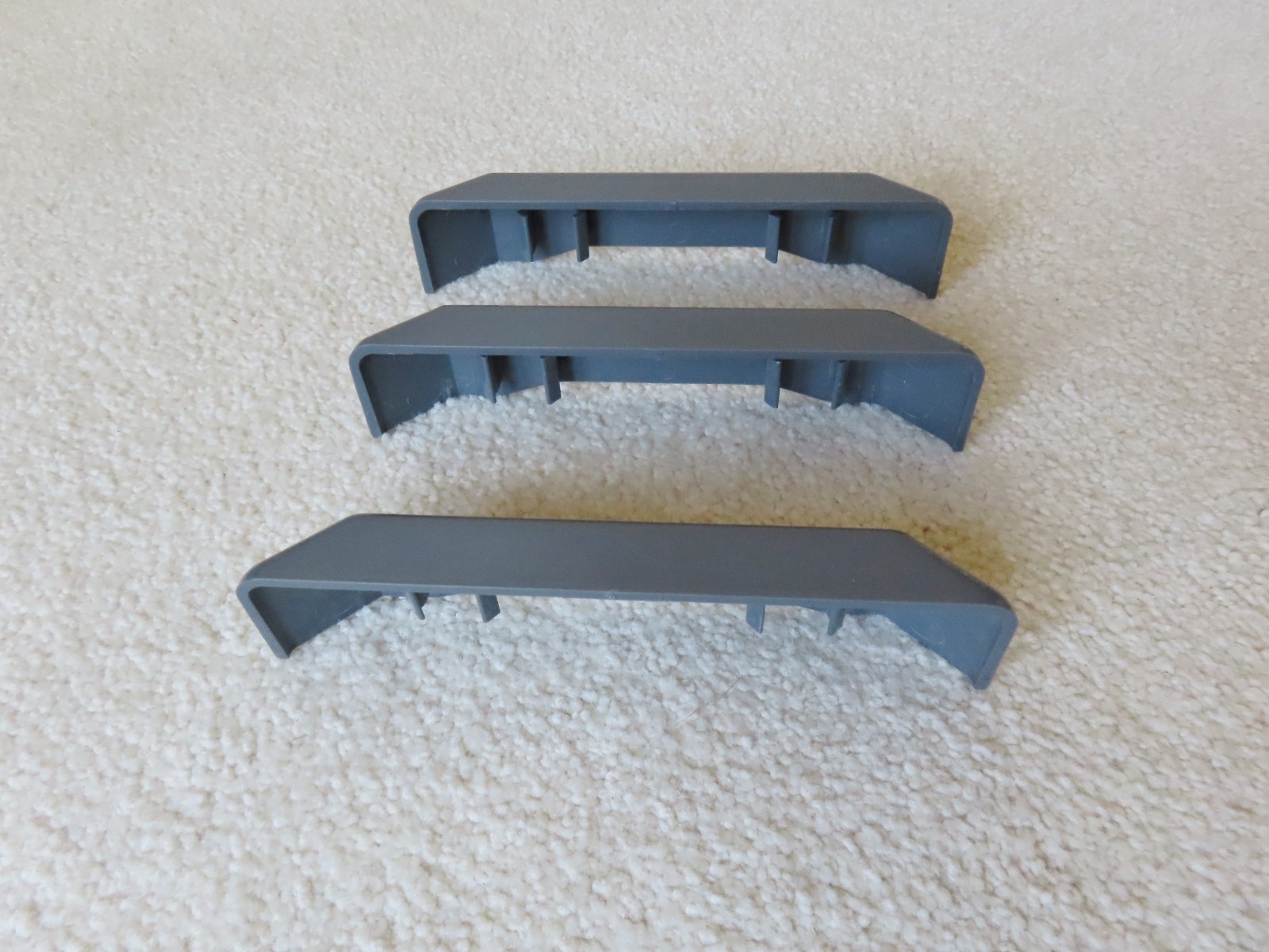 Open Box with Three (3) Individual Gladiator GearTrack Slide On End Caps