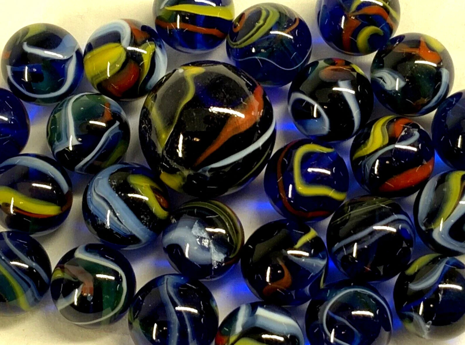 25 Glass Marbles ECLIPSE Translucent Blue Red/Yellow Swirl Pack Shooter