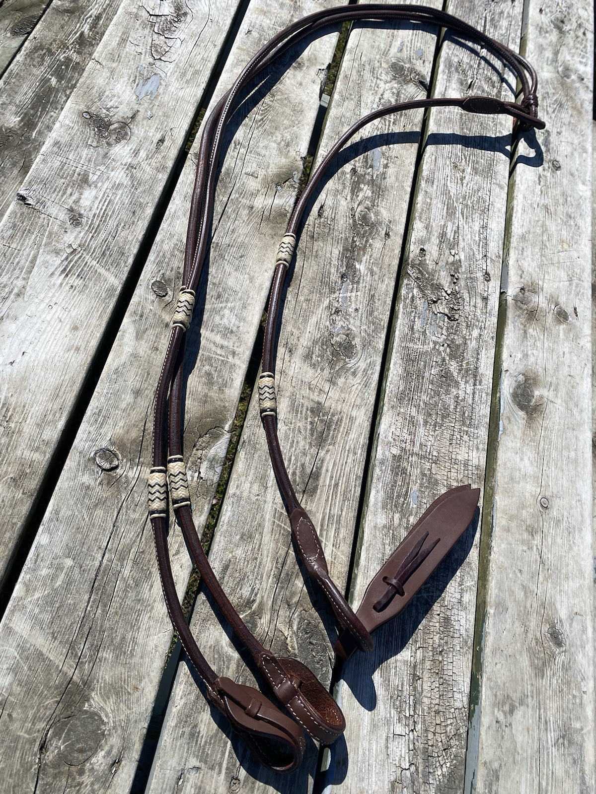 Rolled Argentine leather quick change Romel  reins w/braided rawhide accents