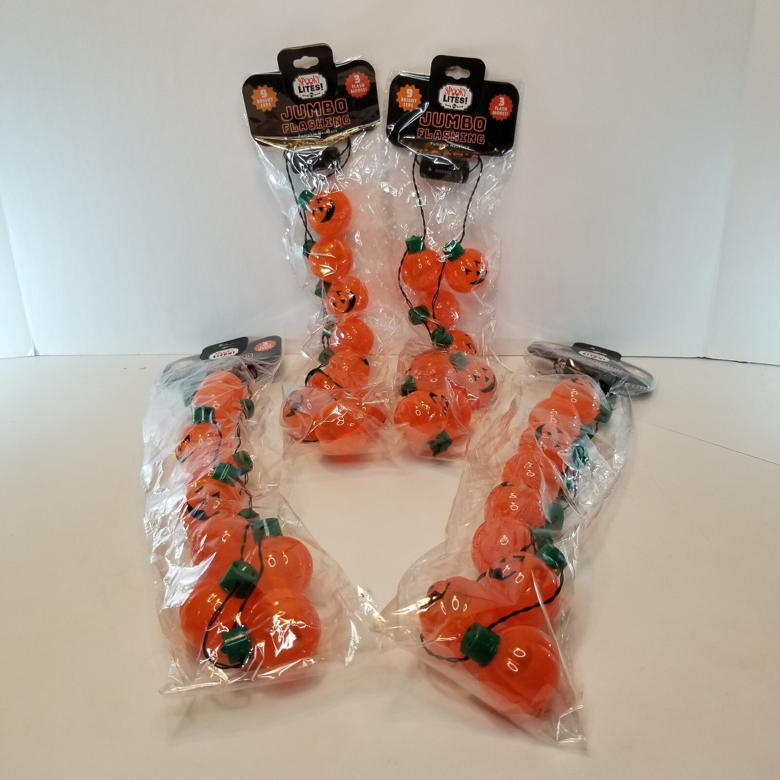 Light up Pumpkin Jack O Lantern  Necklace Halloween 9 Bright LEDs 3 Flash modes.