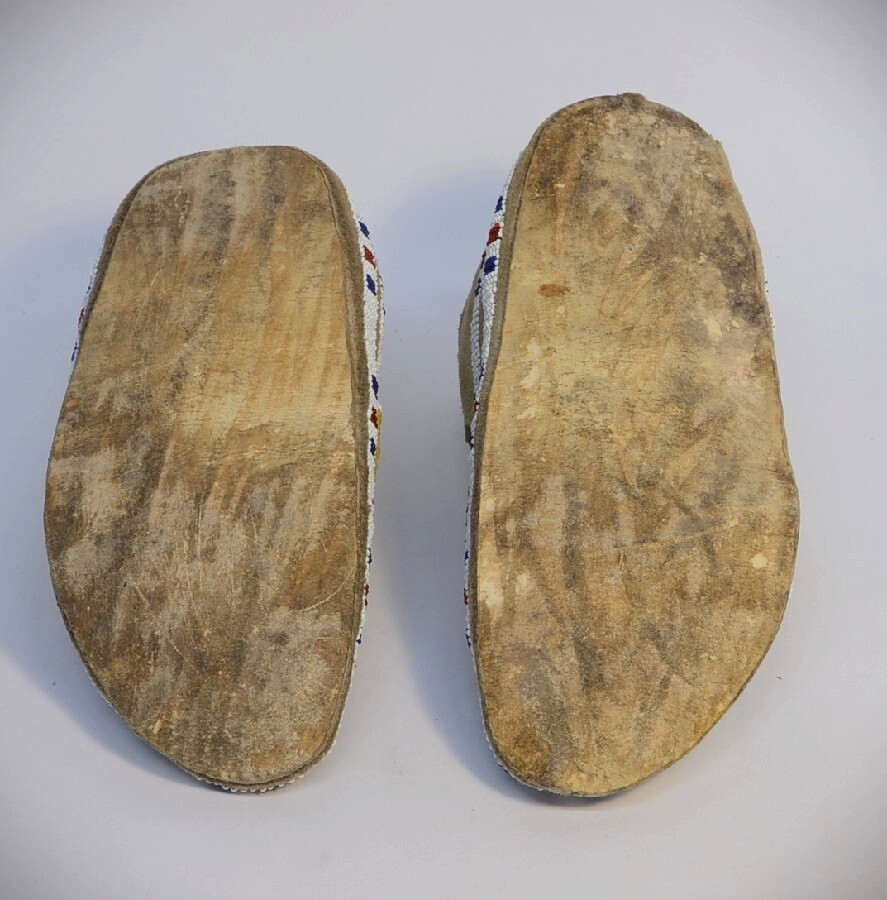 Antique Sioux Moccasins, painted parfleche interior soles