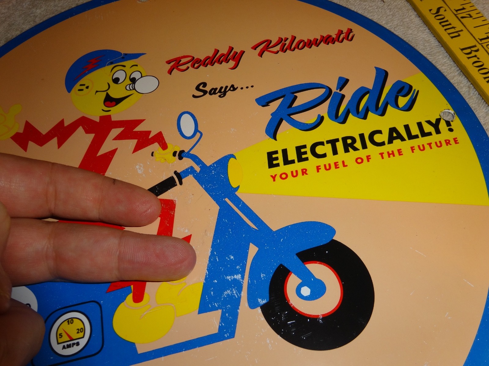 VINTAGE 56 REDDY KILOWATT ELECTRIC SCOOTER 11 3/4" PORCELAIN METAL GASOLINE SIGN