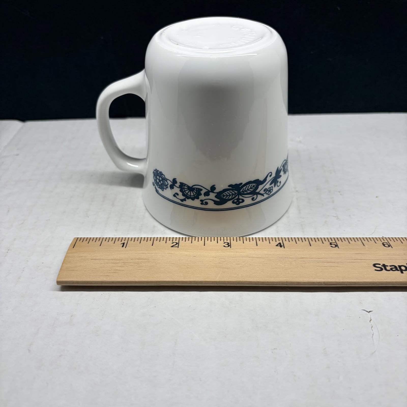 Two white Corning Ware Old Town Blue ceramic mugs with blue floral border.