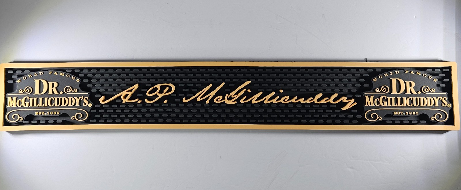 Dr. McGillicuddy's rubber bar mat featuring the brand name A.P. Mcgillicuddys