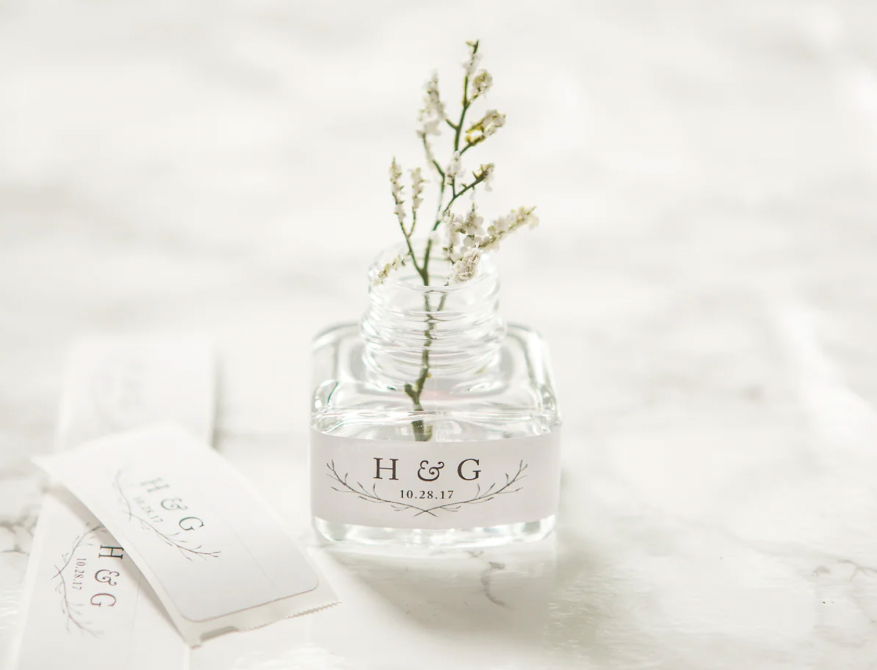 New, empty 50 ml glass square jars with lids, box of 8. Any quantity available