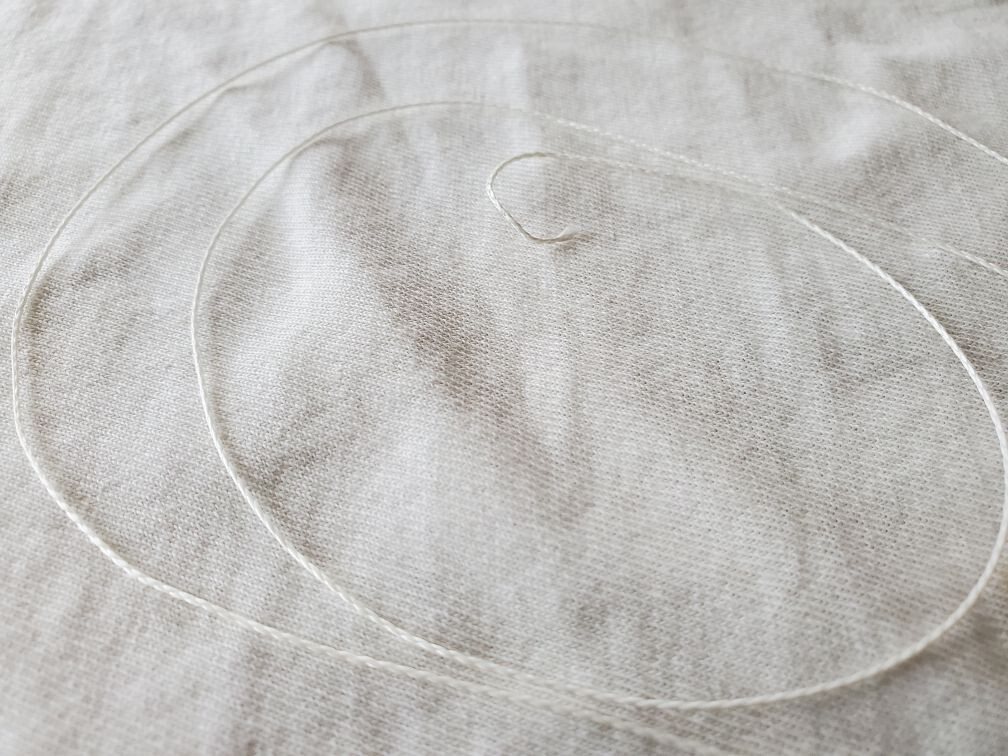 White Radio Dial Cord  .4mm  sold in 12 foot lengths