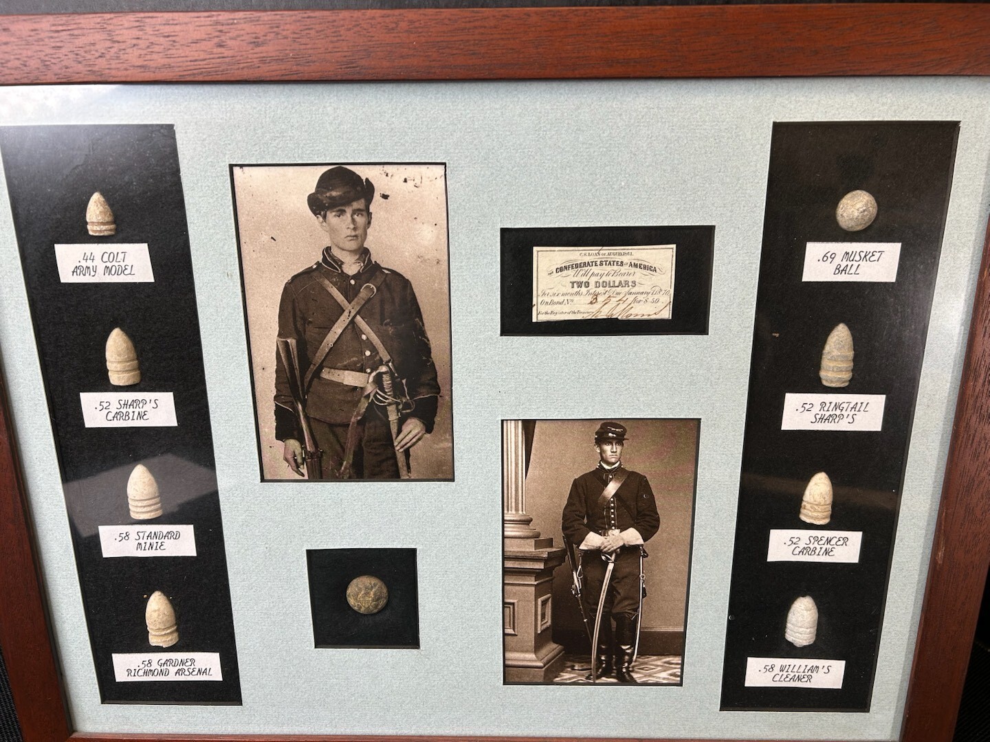 Original framed Civil War bullets and button