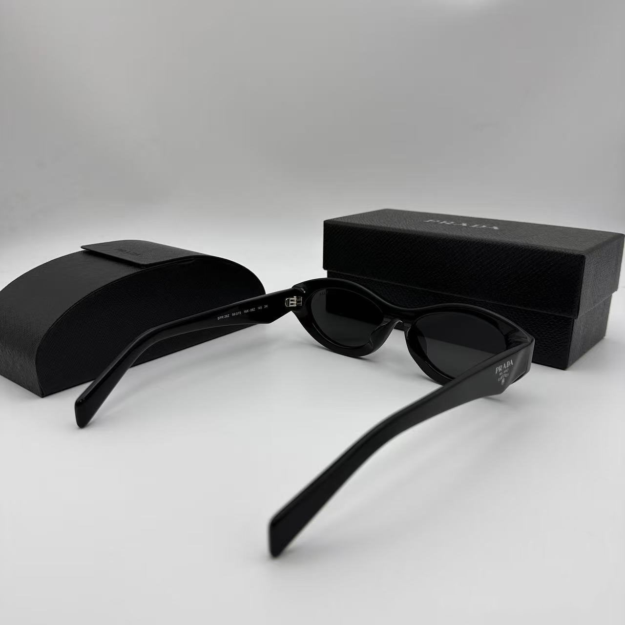 PRADA SPR26Z Black Sunglasses Polished Black Gray Tint Silver Logo