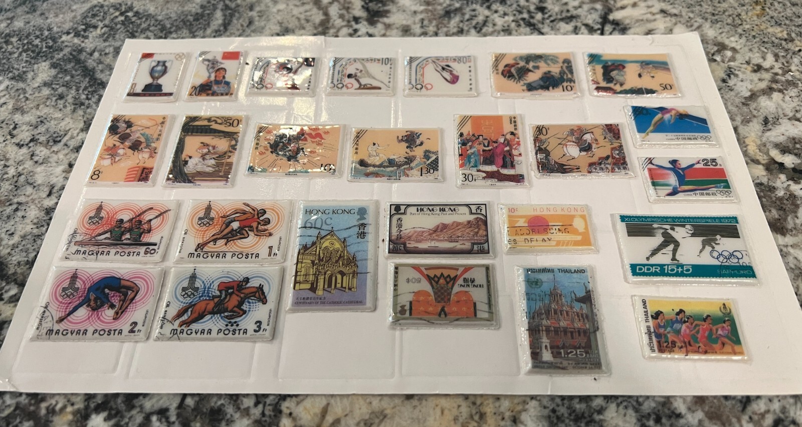 Very Unusual Lot of World Stamps(??) Encased in Padded Plastic w/ Advesive Backs