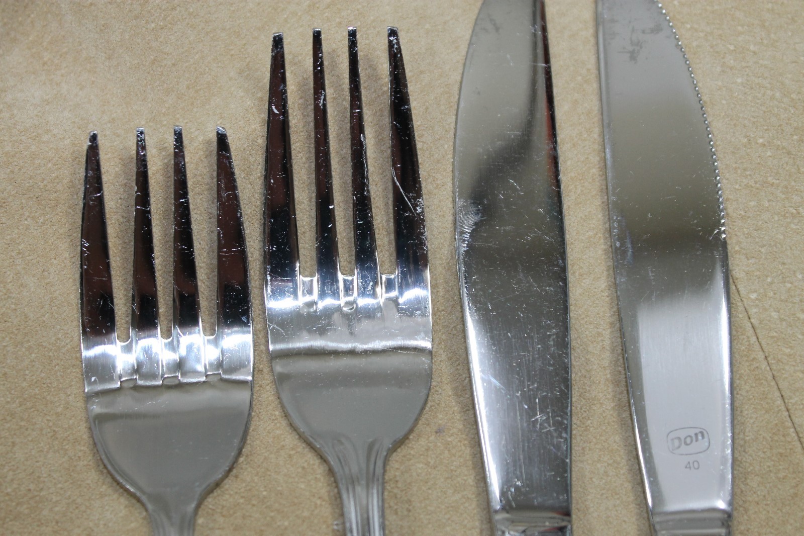 DON stainless flatware lot with knives and forks for catering