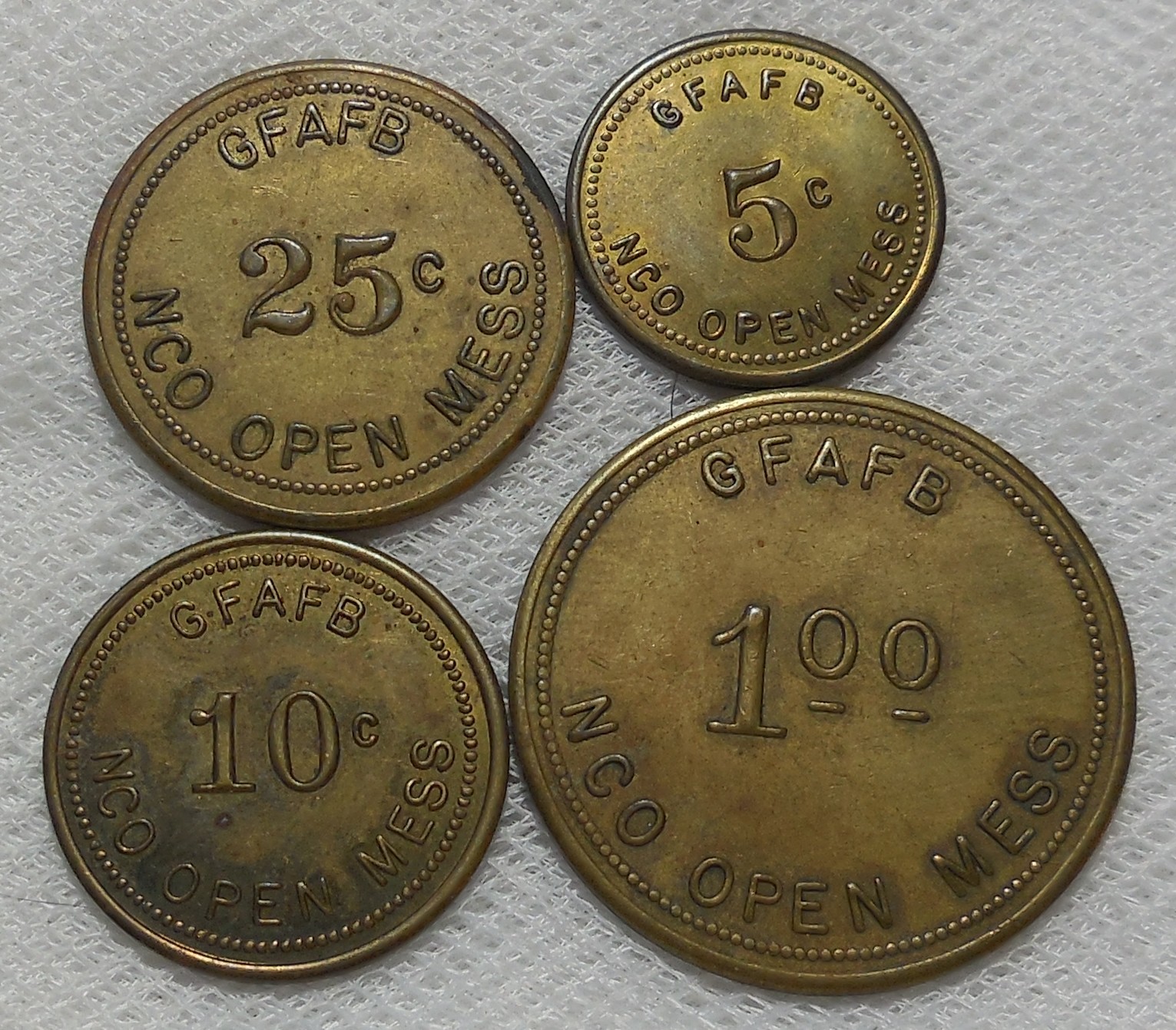 GRAND FORKS AIR FORCE BASE 5¢ 10¢ 25¢ & $1.00 BRASS TRADE TOKENS GFAFB