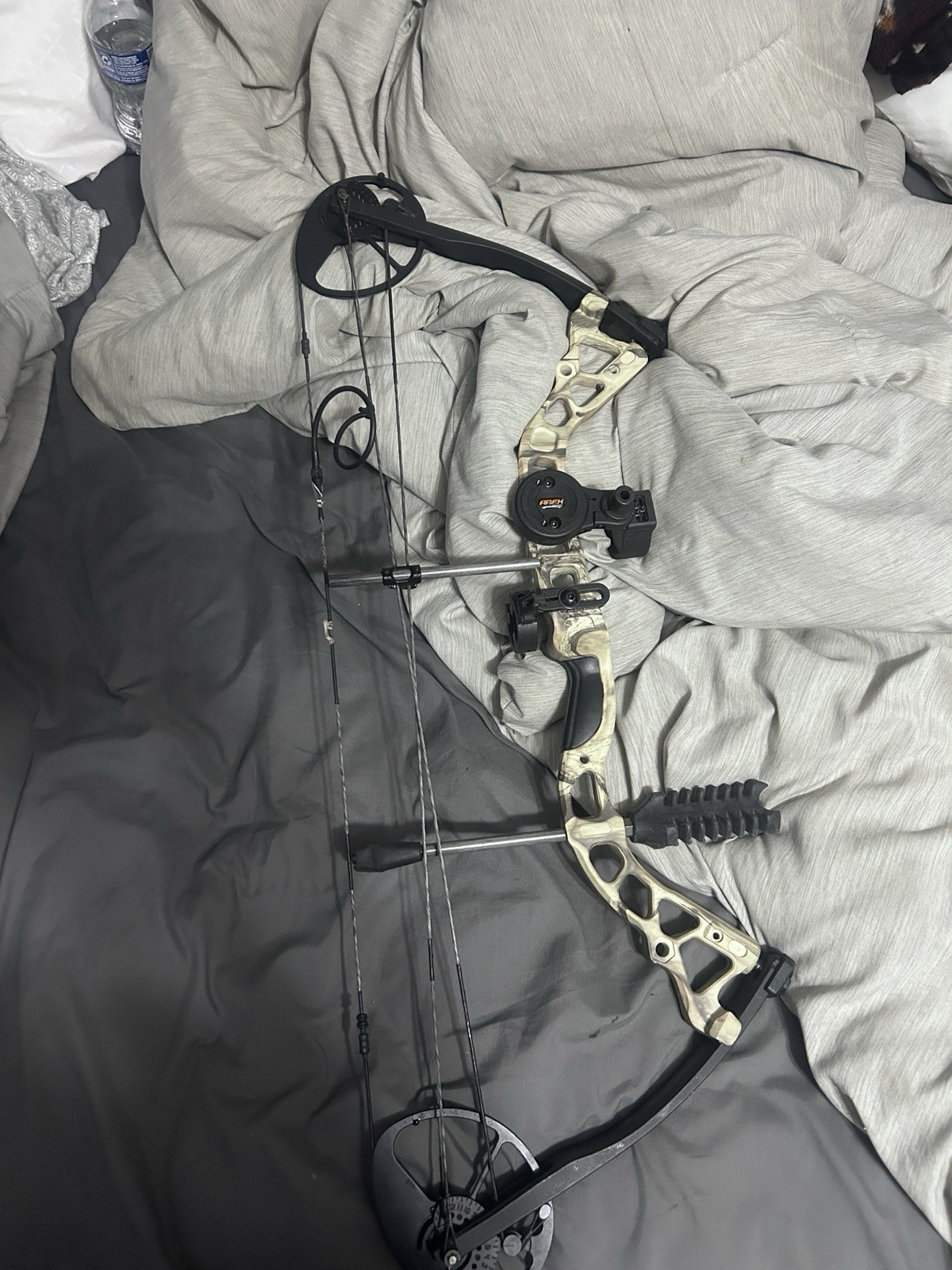 Dimond archery bow edge and climber stand with harness.
