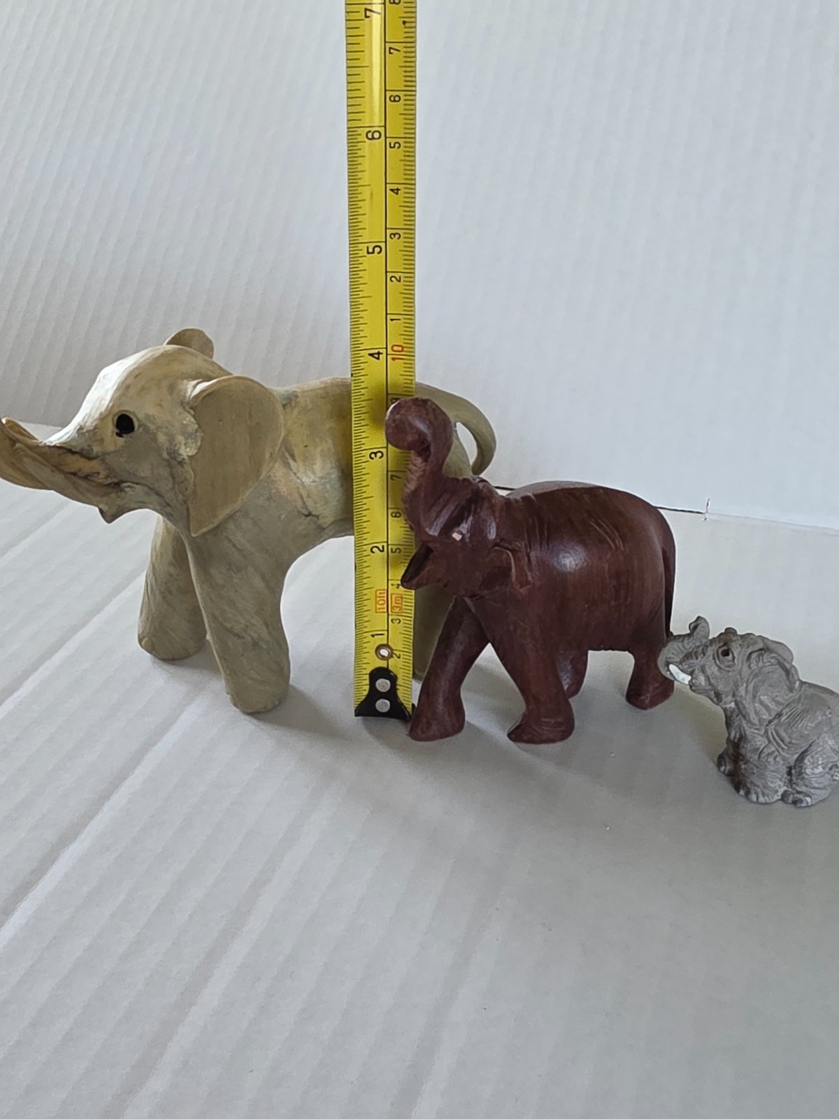 Three elephant figurines