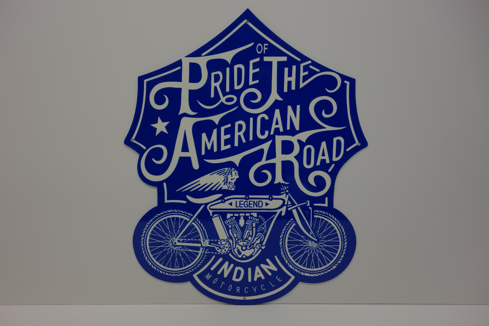 INDIAN MOTORCYCLE DIE CUT STEEL ENAMEL SIGN. 16" BY 20". LARGE PRIDE AMERICAN RD